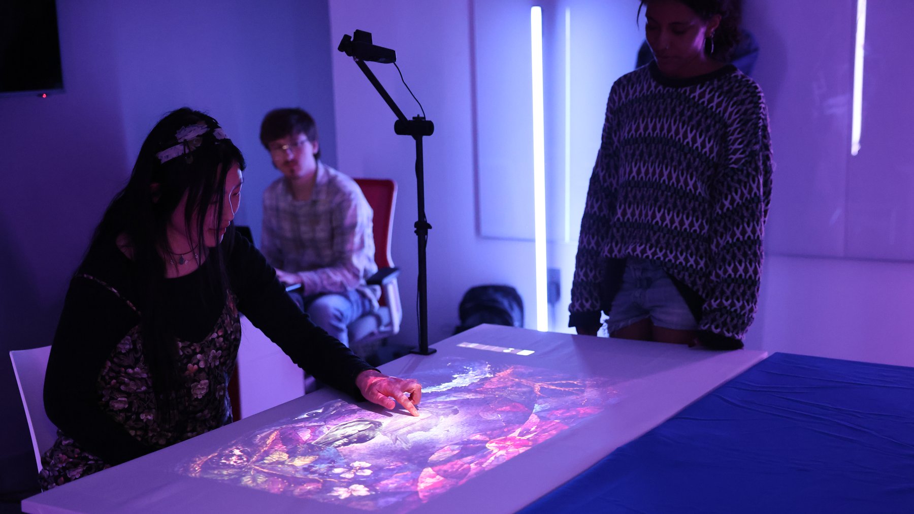 Participant interacting with the projected table interface during Showcase Day