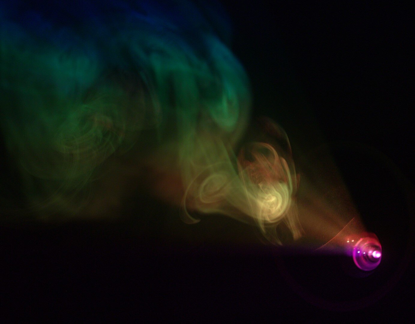 Colored projector beam visible through fog during Project Projection